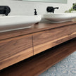 Walnut timber vanity with an open shelf and drawers