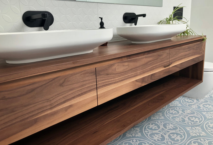 Walnut timber vanity with an open shelf and drawers