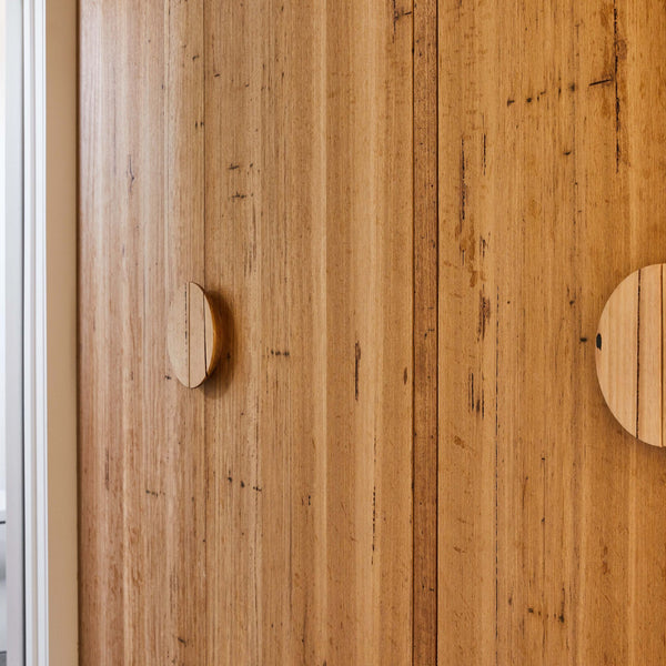 Messmate timber half circle handles on timber cabinetry doors. Made to order in three practical sizes at our factory in Torquay Victoria. Choose from our range of 7 timbers. 