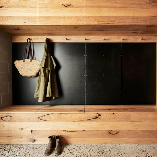 Messmate timber mud room joinery featuring coat hooks and a bench seat with storage